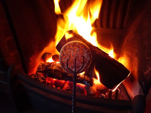 Image result for log fire and crumpets