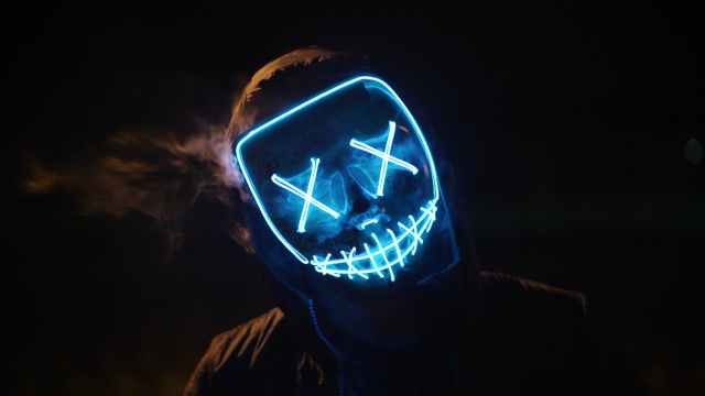 man wearing black and blue mask costume